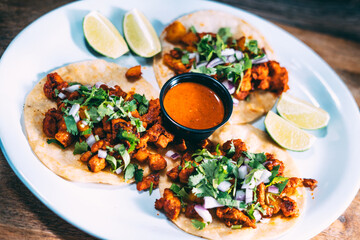 A plate of tacos and tortilla
