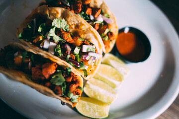 A plate of tacos and tortilla