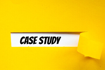 The text Case Study appearing behind torn yellow paper