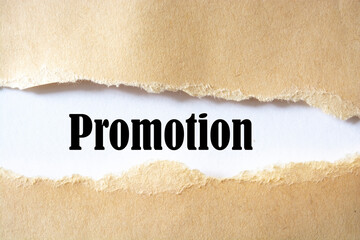 Promotion word written under white torn paper