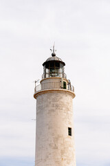 Fototapeta na wymiar closeup of a lighthouse with white background