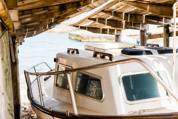 Llaut or old ship in port repair huts facing the water