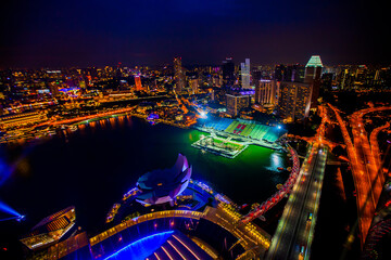 Fototapeta na wymiar Singapore city skyline at Marina bay cityscape by night
