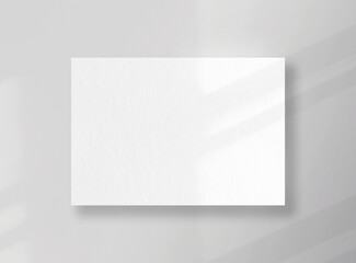 Blank square card, sheet as mockup with sunny shadows on gray surface