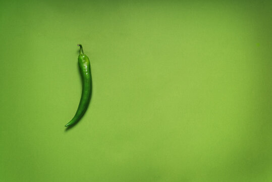 green monochrome with green pepper on a background