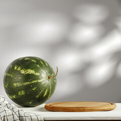 Fresh watermeolon on desk and wall with shadows. 