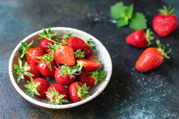 Strawberry fresh fruit berries ripe  sweet dessert summer organic on the table healthy meal copy space food background rustic top view keto or paleo diet vegan or vegetarian food
