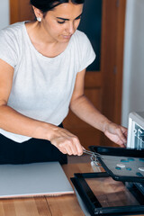 Obraz na płótnie Canvas Artisan Woman Using Oven