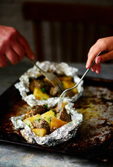Steak and potatoes in the foil..selective focus.