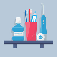 Oral and teeth care. Set of dental cleaning tools. Toothbrushes, electric toothbrush, portable oral irrigator and toothpaste, mouthwash, dental floss are on a shelf. Dental hygiene.