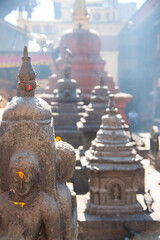 Fototapeta na wymiar Painted statue with background haze at Swayambhunath Stupa