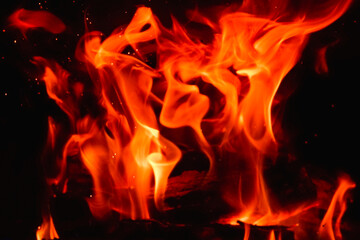 Fire in the fireplace close-up on a long exposure. Background.