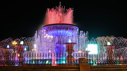 Lighted colorful fountain at night. Fountain in Khabarovsk.
