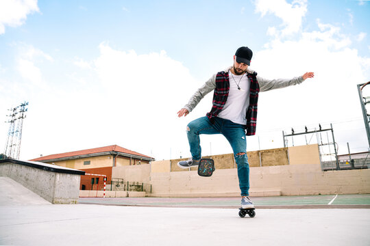 Man on freeline skates near urban parapet