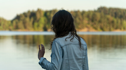 Woman at the lake in summer