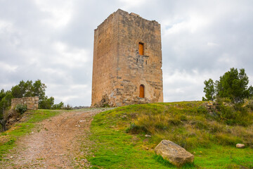 Fototapeta na wymiar Jérica, Alto Palancia, Castellon province, Valencian Community, Spain. Medieval tower. Remains of a castle on top of a hill. Declared a Site of Cultural Interest