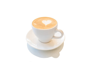 a cup of copuccino on a saucer with a heart painted on the foam
