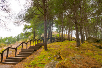 Jérica, Alto Palancia, Castellon province, Valencian Community, Spain. Wooden stairs going up to the Castle remains on top of a hill, overlooking the historic town.