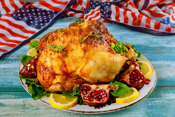 Roasted chicken on plate with american flag.