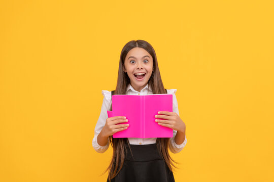 surprised teen girl in school uniform reading book, amasement