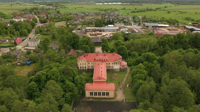 Secondary school in the village of Saranskoye, Kaliningrad region, in the past there was Lauken castle in East Prussia, view from a drone