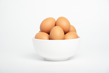 Brown eggs in the white blow. white background