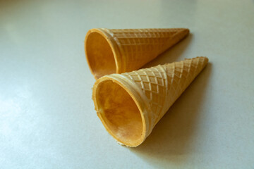 Two empty waffle molds for ice cream