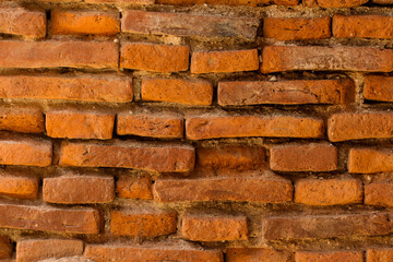 The walls are made of red bricks.