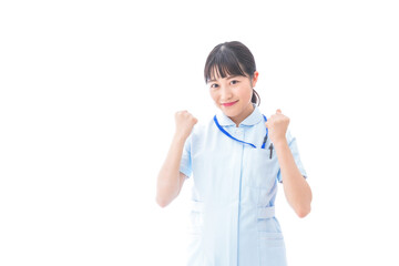 ガッツポーズをする若い看護師