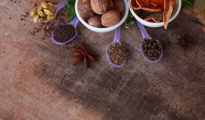spice background, top view.rotation all indian spices on wooden table,Indian cuisine,Cumin, black pepper, cloves, cardamom, fennel, bay leaf,background rotating,
