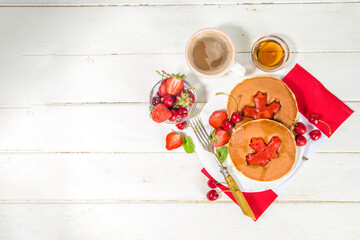 Canada Day concept, brunch menu background. Stack of red and white pancakes with maple leaf creative decoration, idea fod Canada Day breakfast food 