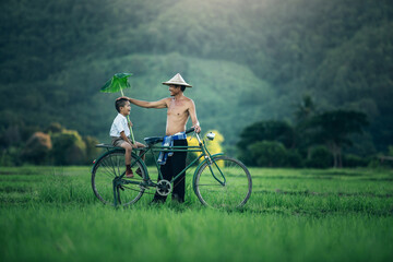 The joy of Thai father and son after school in the countryside, Son and dad this is lifestyle of...