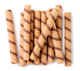 Striped wafer rolls with chocolate close-up on a white. Top view