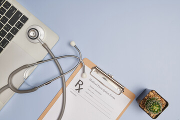 Doctor workplace. Top view of doctor office work with stethoscope, laptop, pen, and clipboard with...