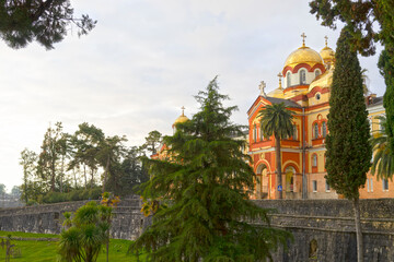 Fototapeta na wymiar Landscape with a view of the ancient New Athos Monastery, Abkhazia
