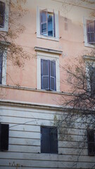Fototapeta na wymiar Blue and orange row houses, Rome, Italy