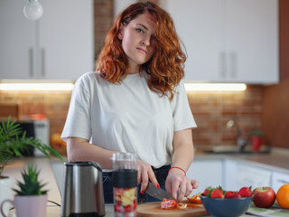 Happy smiling healthy woman prepare smoothie