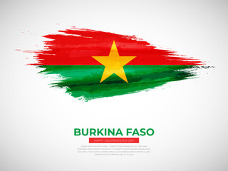 Grunge style brush painted Burkina Faso country flag illustration with Independence day typography