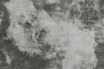 abstract gray painted old wall for background or texture, peeling paint and stucco with cracks like...