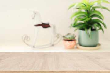 empty table board and defocused indoor background. product display concept