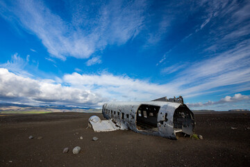 Summer afternoon dramatic sky perspective towards the famous plane crash site at the Southern part of Iceland. You may know it by the music video of Justin Bieber