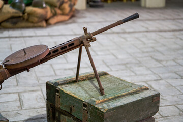 Close-up of heavy machine gun model in military summer camp
