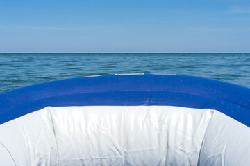 dinghy on the sea with blue sky
