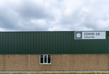 horizontal view of a building used as a Covid-19 test center