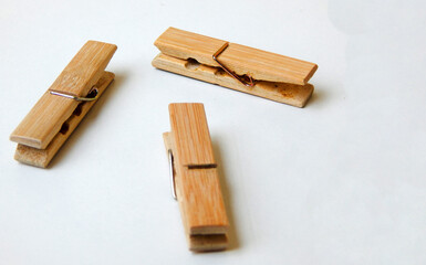 Wooden clothes pin isolated on white background