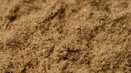Spice coriander powder top view. Condiment or dietary supplement