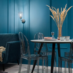 Modern dining table with plastic chairs