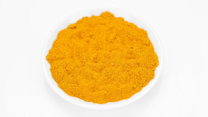 turmeric powder top view on white background. Condiment or dietary supplement.