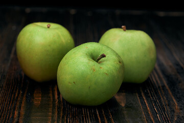 close-up. green apples on a wooden background.