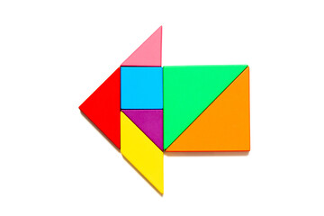 Color tangram puzzle in arrow shape on white background